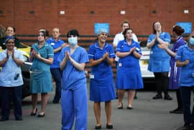 NHS staff taking part in a Clap For Carers celebration outside Leeds General Infirmary.