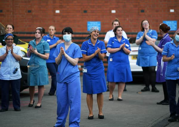 NHS staff taking part in a Clap For Carers celebration outside Leeds General Infirmary.