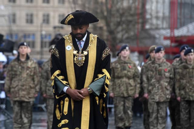 Magid Magid wearing a white poppy at the remembrance parade at Barkers Pool. Picture: Andrew Roe.