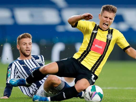 Harrogate Town midfielder Lloyd Kerry is brought down by West Brom's Sam Field during Wednesday night's Carabao Cup second-round tie at the Hawthorns. Pictures: Getty Images