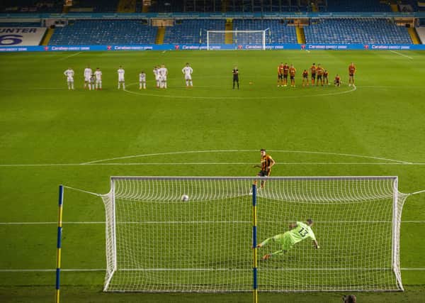 Tigers' Alfie Jones slots past Leeds keeper Kiko Casilla to win the game in a penalty shootout. Picture Tony Johnson
