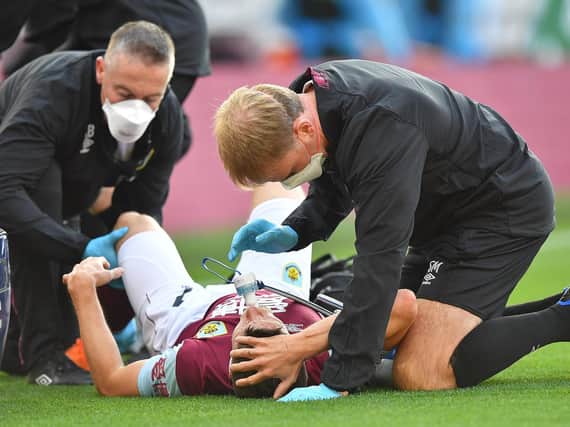INJURY: Johann Berg Gudmunsson receives treatment after his challenge with Jack Robinson