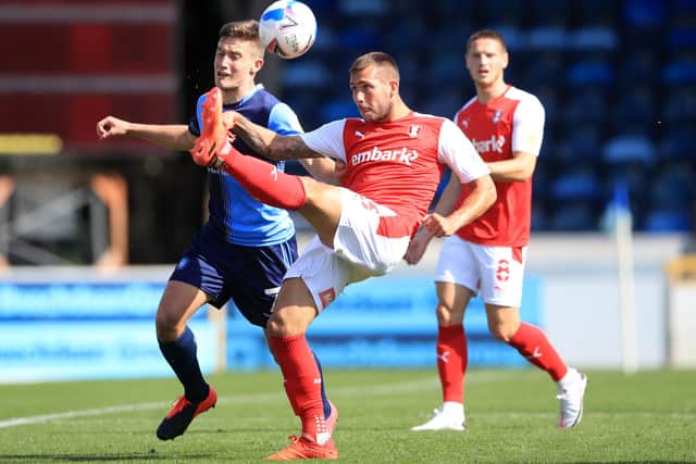 Rotherham United's Joe Mattock (centre) clears the ball during the Sky Bet Championship match at Adams Park (PIcture: PA)