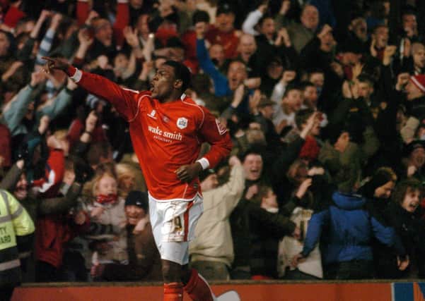 Magic of the Cup: Barnsley striker Kayode Odejayi celebrates his winning goal against Chelsea.