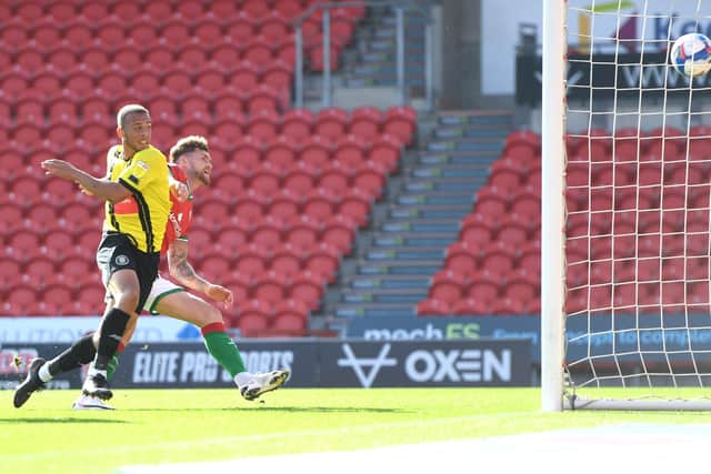 Aaron Martin of Harrogate Town scores his side's first goal. (Photo by George Wood/Getty Images)