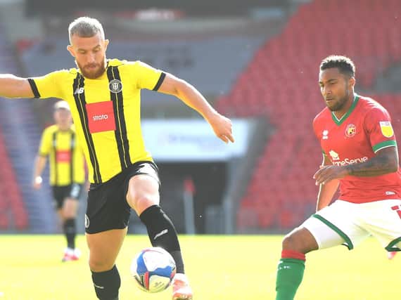 George Thomson in action during Harrogate Town's League Two clash with Walsall at the Keepmoat Stadium. Pictures: Getty Images