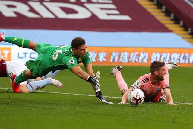 Sheffield United's Chris Basham is fouled by Matt Targett (hidden) leading to a penalty at Villa Park, although John Lundstram missed the spot-kick. Picture: Simon Bellis/Sportimage