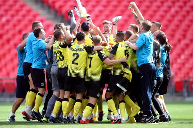 RETURN TRIP: Harrogate Town players and staff celebrate after the final whistle at Wembley. Picture: Adam Davy/PA