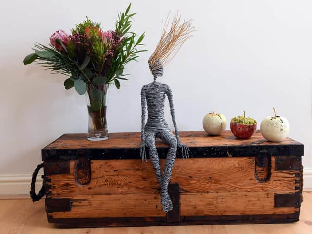 One of Nick’s wooden chests with a wire sculpture by Rachel Ducker and ceramic apples by Remon Jephcott.