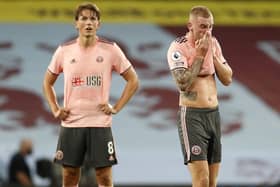 Disappointed: Oli McBurnie and Sander Berge, left, after Shefield United's defeat to Aston Villa. Picture: SportImage