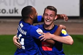 Will Smith, right, is congratulated by Brendan Kiernan after heading Harrogate Town into a 1-0 lead against Notts County. Pictures: Getty Images