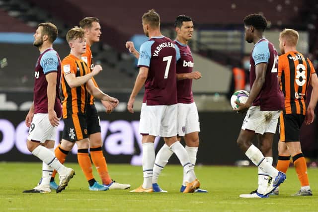 West Ham United and Hull City players fist-bump after the final whistle.
