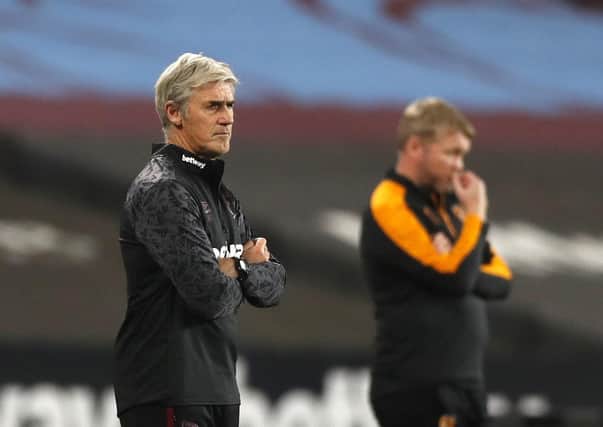 Stepping in: Alan Irvine, left, alongside Hull City manager Grant McCann, took charge of the Hammers. Picture: PA