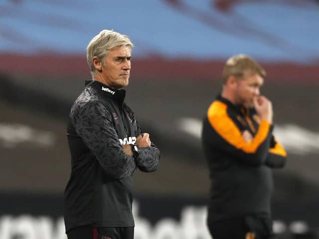 Stepping in: Alan Irvine, left, alongside Hull City manager Grant McCann, took charge of the Hammers. Picture: PA