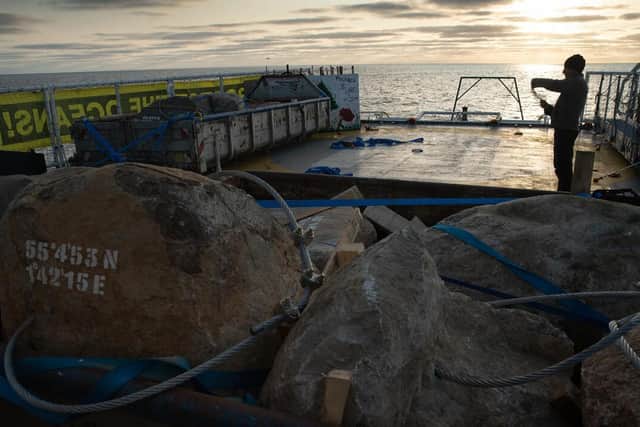 A crew member works near stones at sunrise on the Greenpeace ship, Esperanza.
Picture:Suzanne Plunkett/Greenpeace