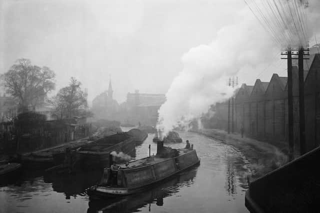 A steam powered canal tug boat towing a string of coal carrying barges along the Grand Union Canal to Kensal Green gas works in north west London.   (Photo by Hulton Archive/Getty Images)
