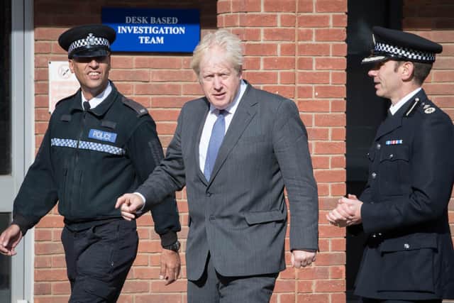Boris Johnson during a visit to Northamptonshire Police as Chanclelor Rishi Sunak issued an emergency economic statement.
