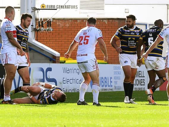 Leeds Rhinos' Harry Newman lies in agony after suffering double leg fracture. (PIC: JONATHAN GAWTHORPE)