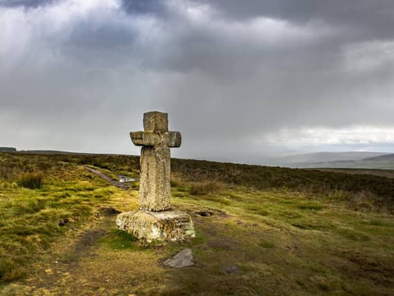 Rain approaches the Cowper' Cross on Ilkley Moor. Picture: Bruce Rollinson. Technical details: Nikon D4 24mm lens, 1/500 SEC, f/6.3, ISO 400