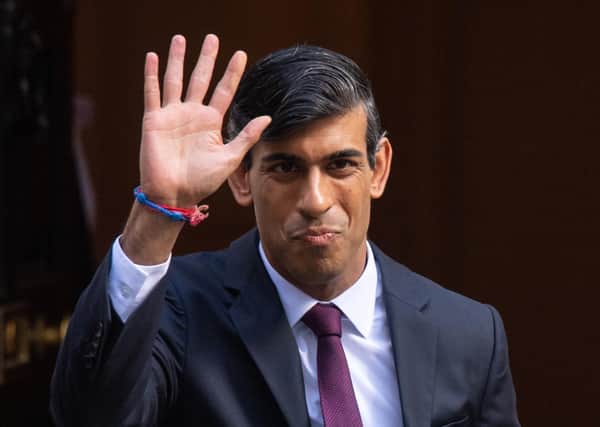 Chanclelor Rishi Sunak leaves 11 Downing Street to deliver his Winter Jobs Plan to Parliament.