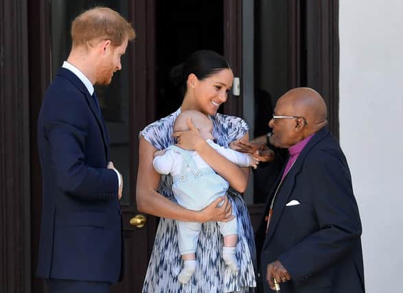 The Duke and Duchess of Sussex holding baby Archie as they meet Archbishop Desmond Tutu in Cape Town. The high profile family tour to southern Africa cost the taxpayer nearly GBP246,000 according to new accounts.