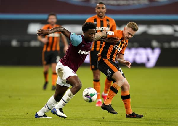 West Ham United's Aji Alese (left) and Hull City's Thomas Mayer in action this week.