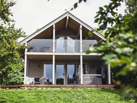 The lodge is architect-designed and has large areas of glazing to make the most of the rural views.
