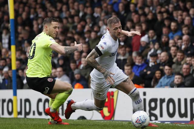 Leeds Unted's Liam Cooper tackles Sheffield United's Billy Sharp. Picture: Simon Bellis/Sportimage