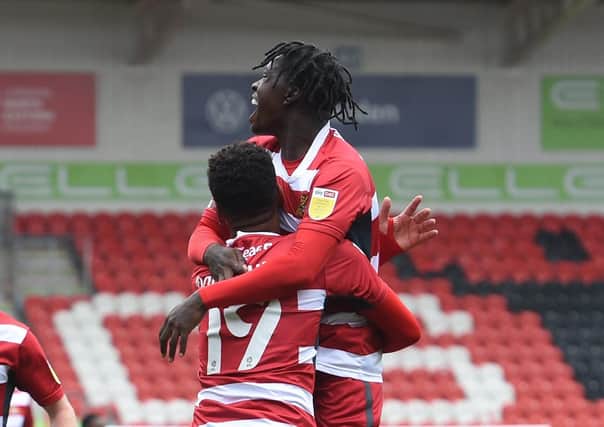 Doncaster's Taylor Richards celebrates his goal with Tyreece John-Jules (Picture: Howard Roe)