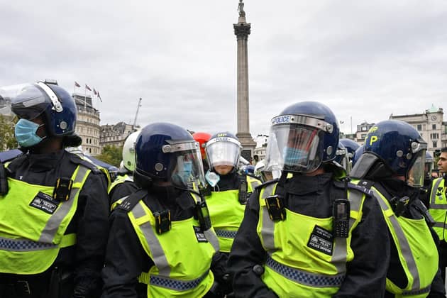 Police at a 'We Do Not Consent' rally at Trafalgar Square in London, organised by Stop New Normal, to protest against coronavirus restrictions. Photo: Stefan Rousseau/PA Wire
