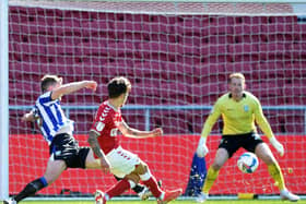 Bristol City’s Jamie Paterson beats Sheffield Wednesday’s Cameron Dawson to make it 2-0 , inflicting the Owls’ first defeat in the Championship this season.  Picture: Steve Ellis