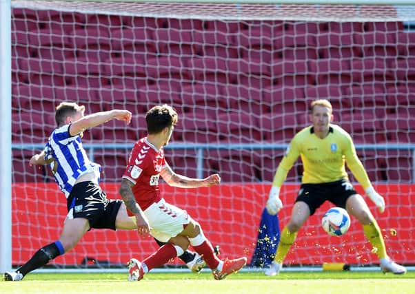 Bristol City’s Jamie Paterson beats Sheffield Wednesday’s Cameron Dawson to make it 2-0 , inflicting the Owls’ first defeat in the Championship this season.  Picture: Steve Ellis