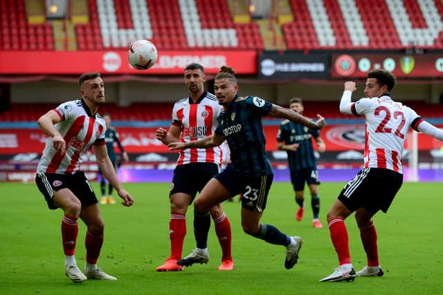Kalvin Phillips is crowded out by Blades players. Picture: James Hardisty.