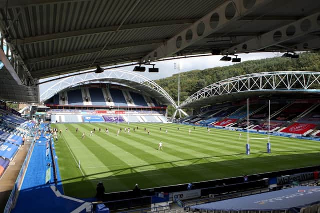 Match action between Catalan Dragons and Wakefield Trinity  in front of empty stands at Huddersfield (Picture: PA)