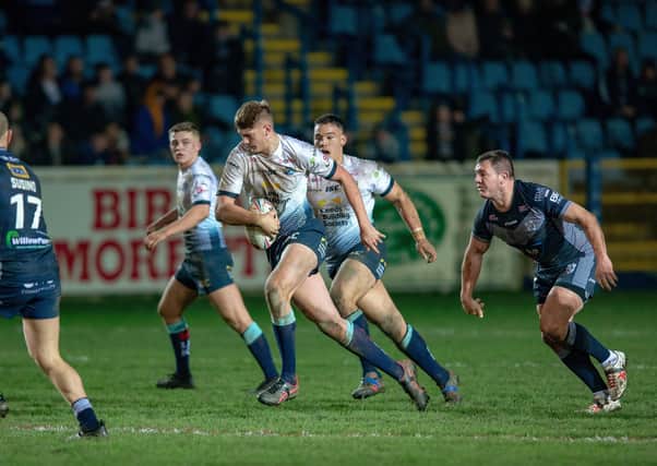 Brett Ferres watches on as Leeds Rhinos' Sam Walters breaks through in a clash with Featherstone Rovers. earlier this year. Picture: Bruce Rollinson