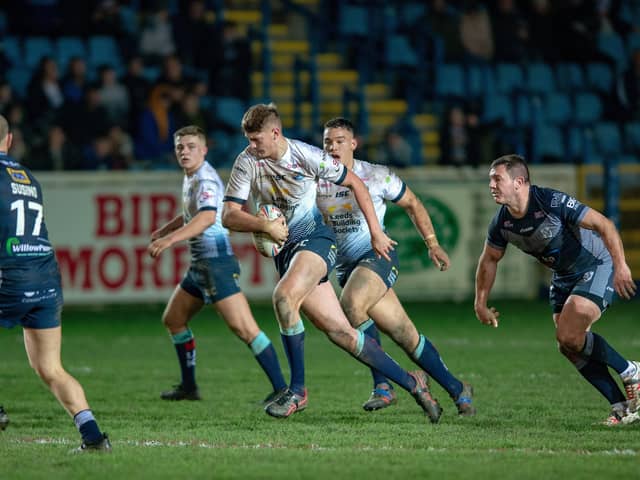 Brett Ferres watches on as Leeds Rhinos' Sam Walters breaks through in a clash with 
Featherstone Rovers. earlier this year. Picture: Bruce Rollinson
