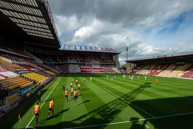 EMPTY FEELING: Bradford City take on Colchester United in front of the deserted Valley Parade stands.  Picture: Bruce Rollinson
