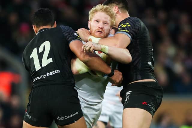 SNARLING AGGRESSION: England's James Graham is tackled by New Zealand's Issac Liu and Jesse Bromwich at Anfield in November 2018. Picture by Alex Whitehead/SWpix.com