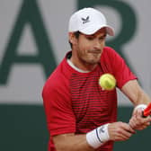 Early exit: Britain's Andy Murray plays a shot in his heavy defeat against Switzerland's Stan Wawrinka. (AP Photo/Christophe Ena)