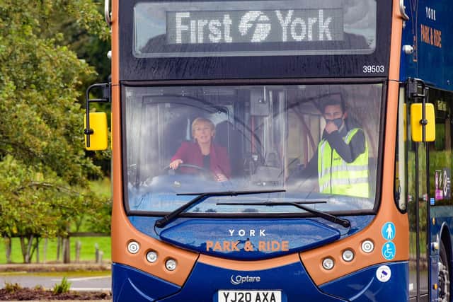 Baroness Vere drives an electric bus during a visit to York