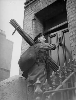 1938:  George Butler, a chimney sweep in Chelsea knocking on doors looking for business.  (Photo by London Express/Getty Images)