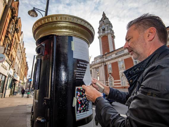A postbox featuring the image 'Queuing at the RA' by Yinka Shonibare CBE, on Acre Lane, Brixton, one of four special edition postboxes unveiled by Royal Mail to mark Black History Month. Credit: James Linsell-Clark/South West News Service/PA Wire