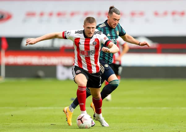 Sheffield United's John Lundstram (left) and Leeds United's Jack Harrison battle for possession at Bramall Lane. Picture: Alex Livesey/NMC Pool/PA.
