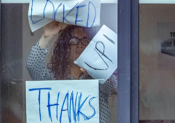 Signs on a window at Manchester Metropolitan University's Birley campus where hundreds of students have been told to self-isolate. Photo: Peter Byrne/PA Wire