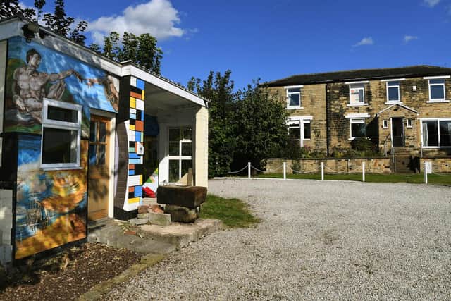 Stephen's garden studio is decorated with a recreation of Michaelangelo’s Creation of Adam and JMW Turner’s The Fighting Temeraire. A tribute to Mondrian runs up the middle of the building.