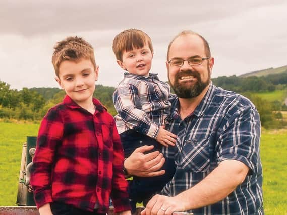 Chris Trousdale and sons Isaac, 7, and Peter, 3 Picture: John Kenny Photography