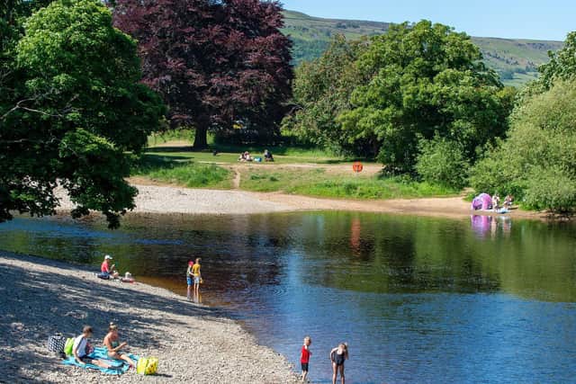 The River Wharfe at Ilkley is popular with people enjoying a picnic and a paddle on summer days. Image: Bruce Rollinson