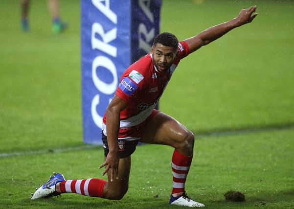 Pointing the way: Salford Red Devils' Kallum Watkins celebrates scoring his side's first try and setting up a final against former club Leeds. Picture: PA
