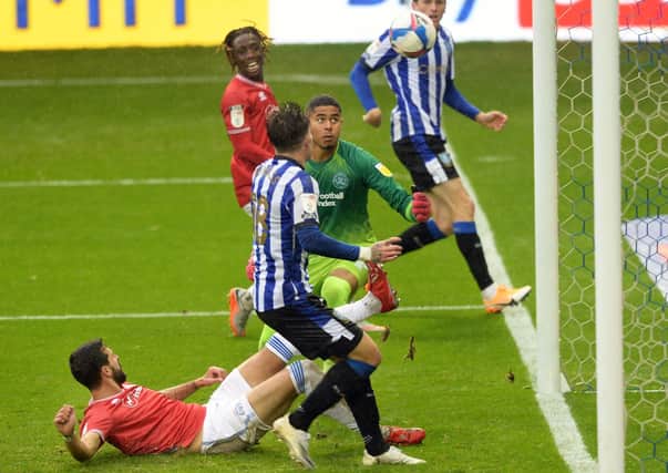 QPR’s Yoann Barbet diverts the ball into his own net. Picture: Steve Ellis