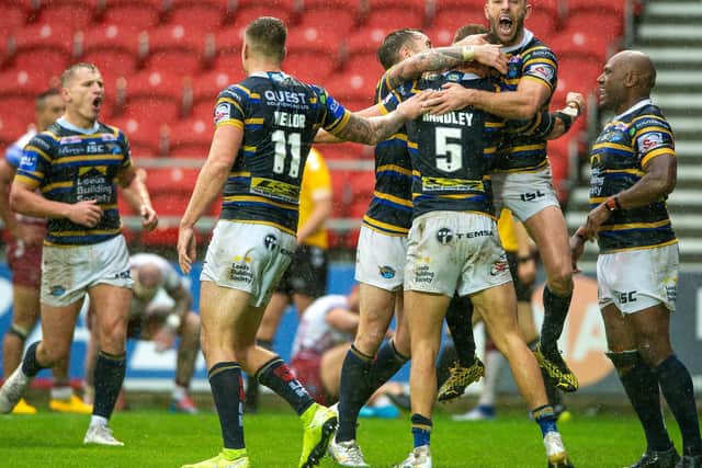 Leeds Rhinos players celebrate with try-scorer Ash Handley (PIC: BRUCE ROLLINSON)